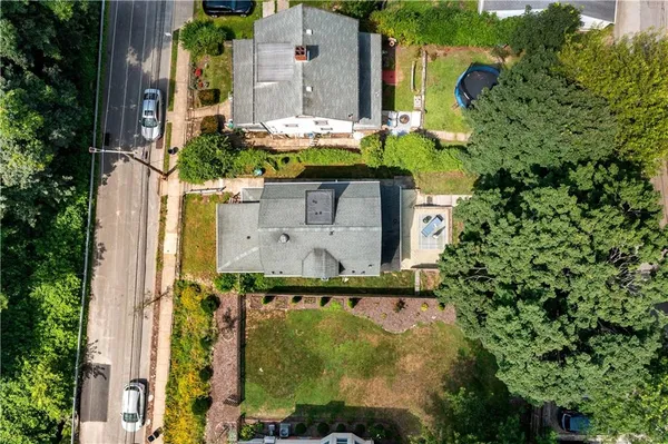 aerial view of a house with yard