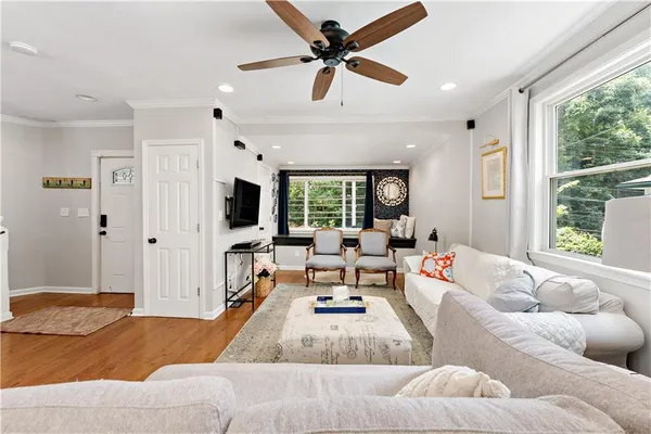a living room with furniture and a flat screen tv