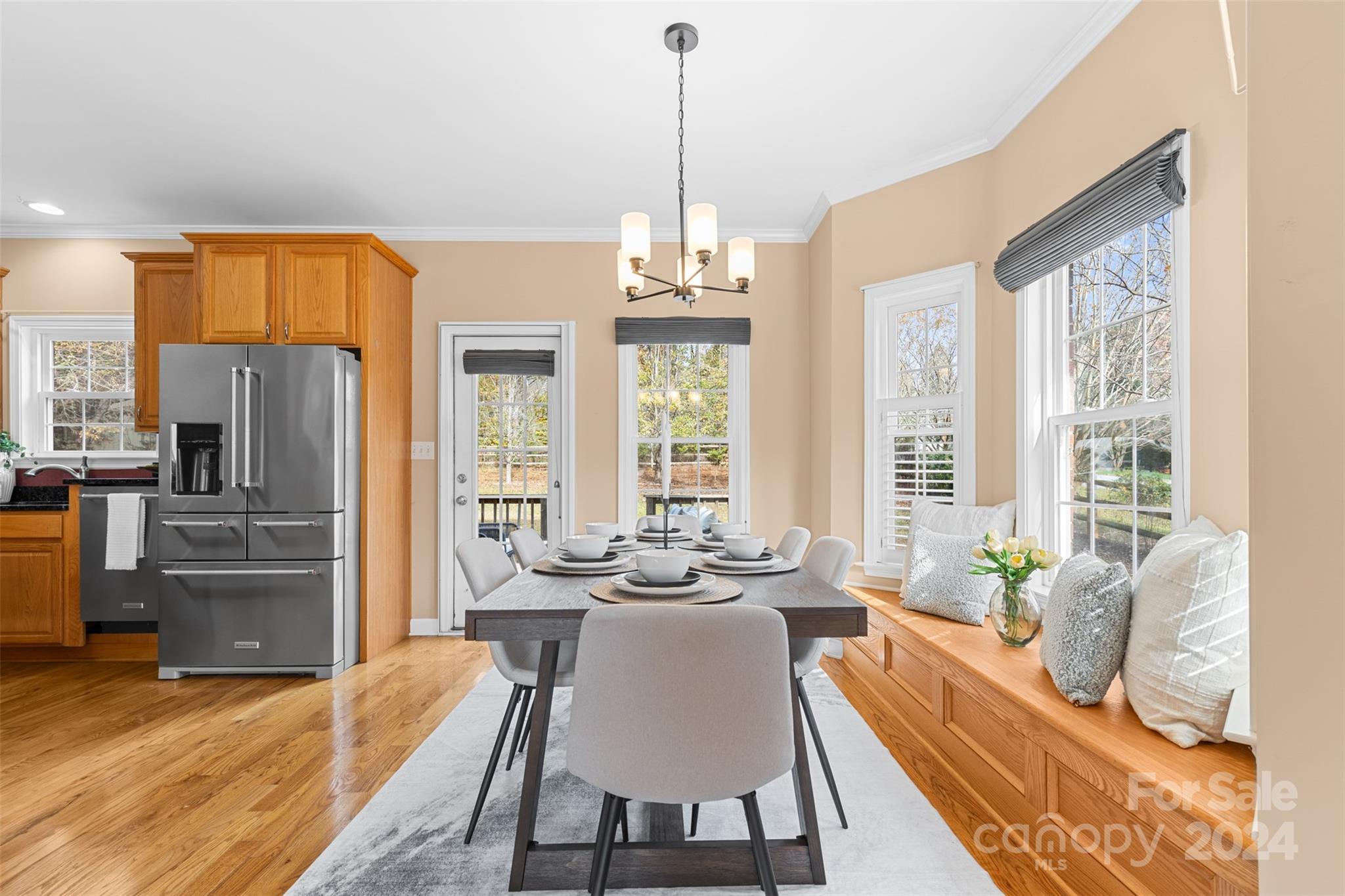 7189 Windy Pine Circle Denver, NC 28037 - Photo 16 of 34 a living room with furniture a large window and a chandelier