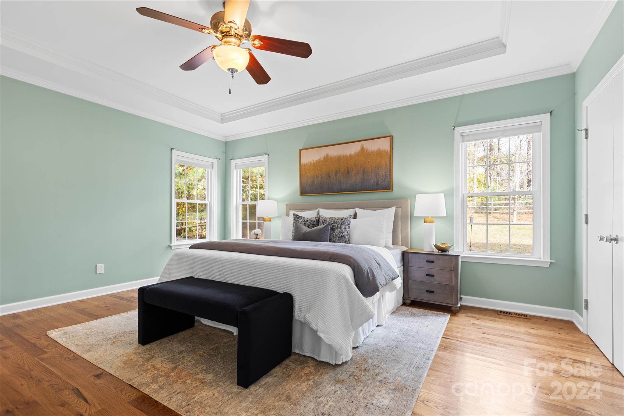 7189 Windy Pine Circle Denver, NC 28037 - Photo 18 of 34 a bedroom with a bed and a chandelier