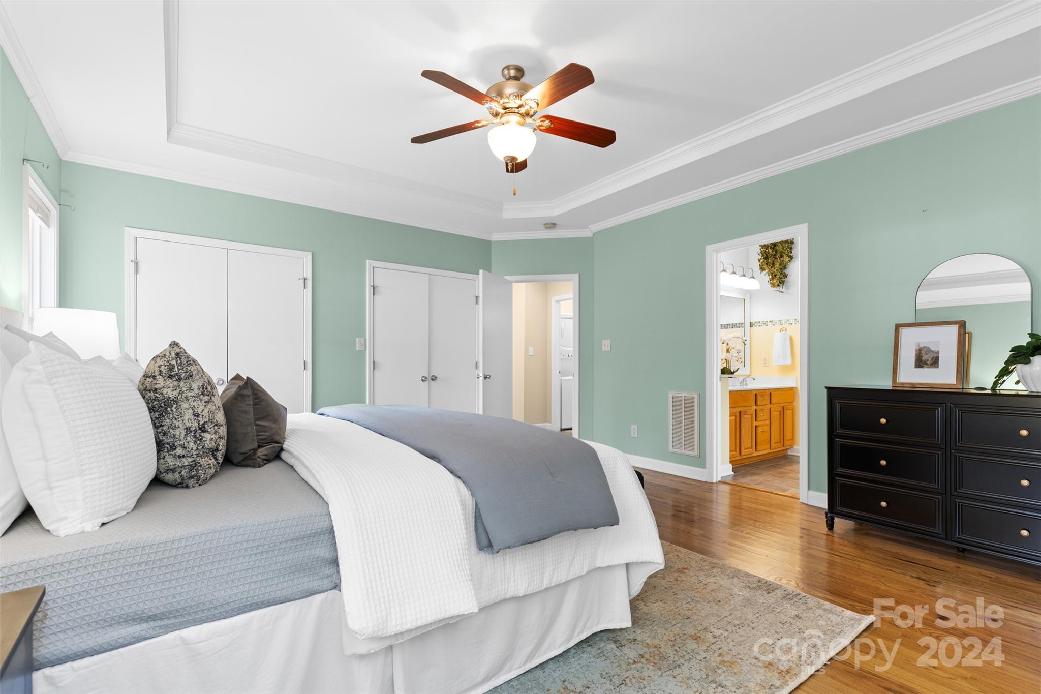7189 Windy Pine Circle Denver, NC 28037 - Photo 19 of 34 a bedroom with a large bed and a dresser