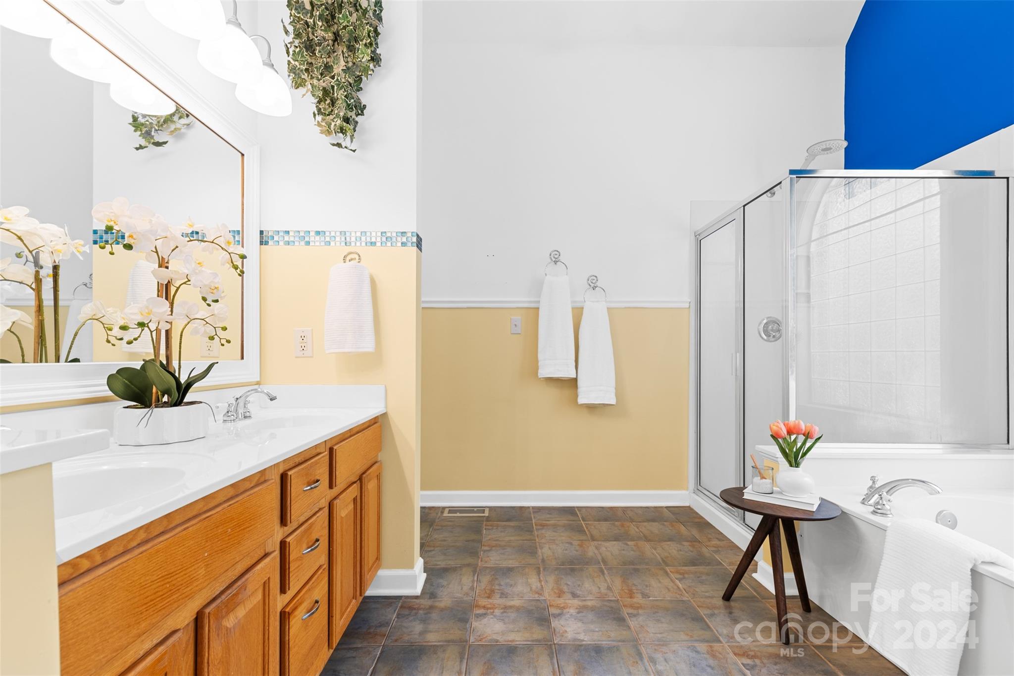 7189 Windy Pine Circle Denver, NC 28037 - Photo 20 of 34 a bathroom with a granite countertop sink a mirror and a shower