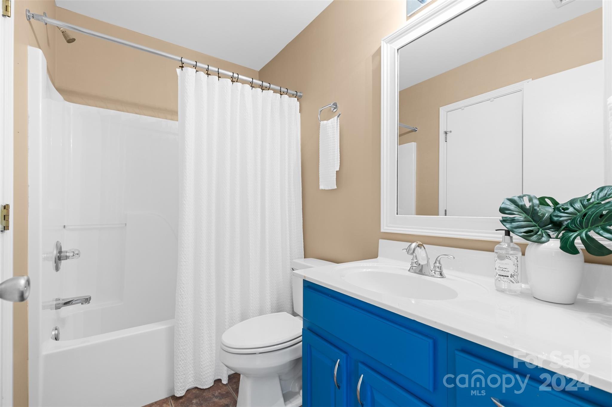 7189 Windy Pine Circle Denver, NC 28037 - Photo 24 of 34 a bathroom with a sink a toilet and shower