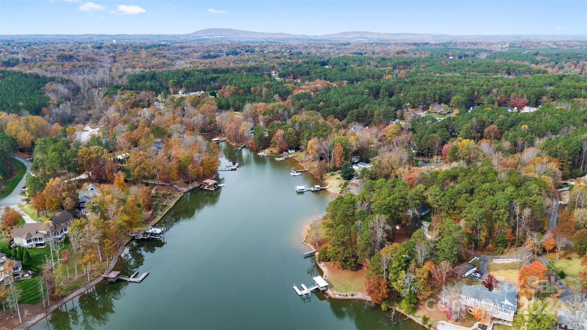 7189 Windy Pine Circle Denver, NC 28037 - Photo 29 of 34 an aerial view of a city with lots of residential buildings and mountain view in back
