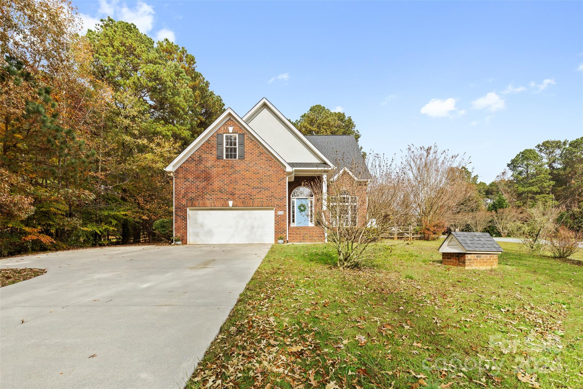 7189 Windy Pine Circle Denver, NC 28037 - Photo 33 of 34 a front view of a house with garden