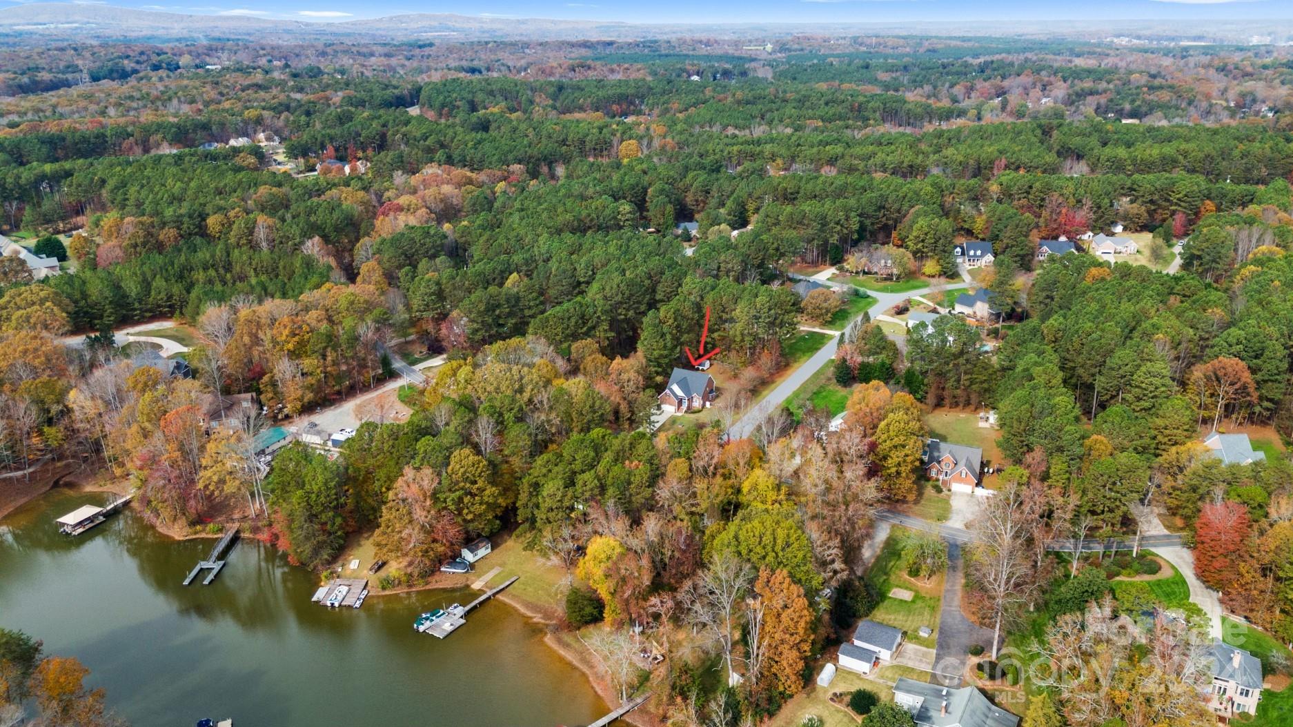 7189 Windy Pine Circle Denver, NC 28037 - Photo 7 of 34 an aerial view of a houses with a lush green hillside