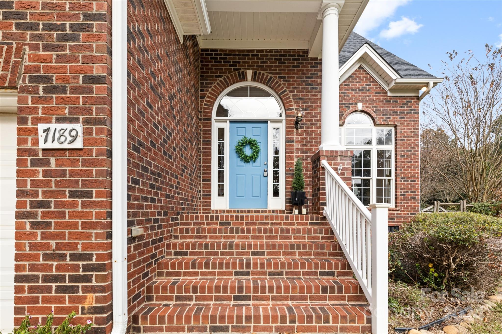 7189 Windy Pine Circle Denver, NC 28037 - Photo 8 of 34 a view of a brick wall with many windows