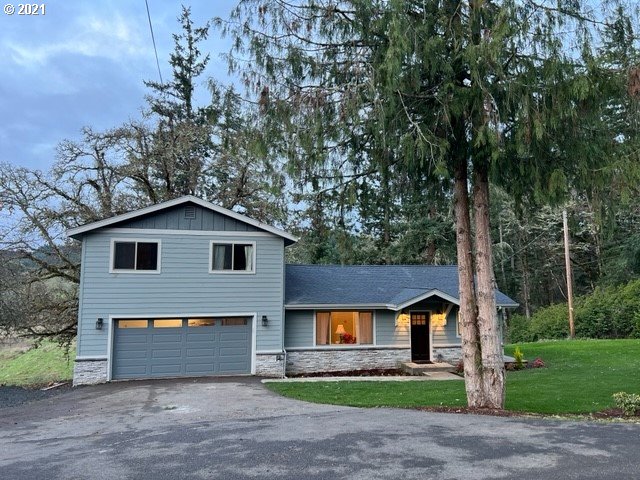 83490 Rattlesnake Road Dexter, OR 97431 - Photo 1 of 27 a front view of a house with a garden and yard
