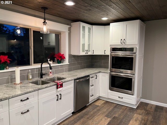 83490 Rattlesnake Road Dexter, OR 97431 - Photo 12 of 27 a kitchen with stainless steel appliances granite countertop a sink stove and cabinets