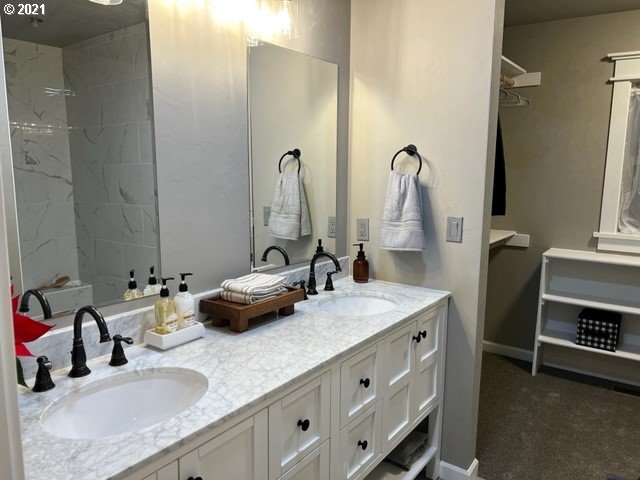 83490 Rattlesnake Road Dexter, OR 97431 - Photo 14 of 27 a bathroom with a sink double vanity and a mirror