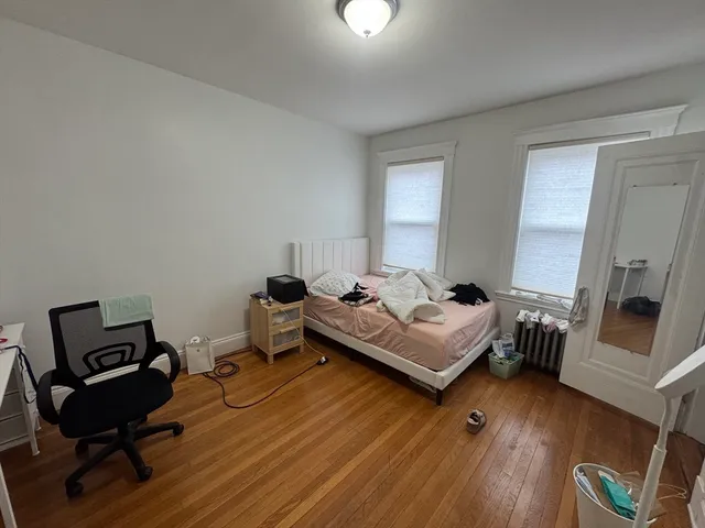 a bedroom with a bed and furniture