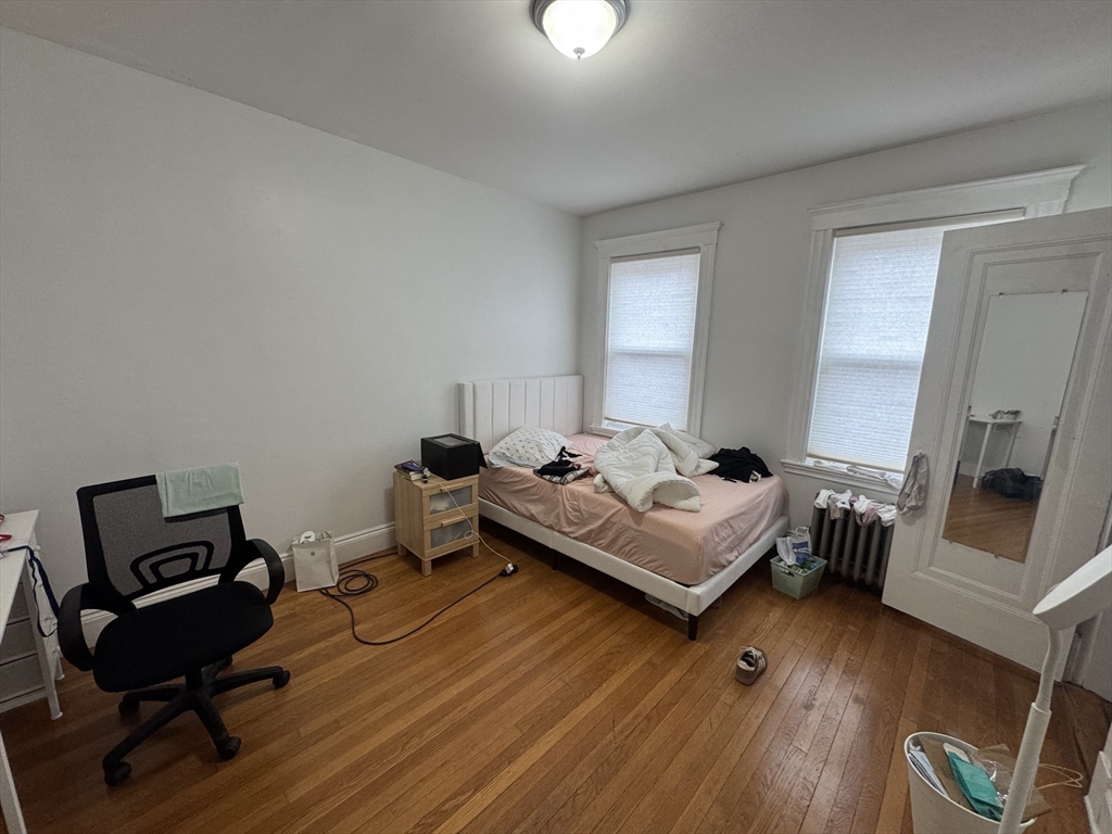 10 Alton Court, Unit 2 Brookline, MA 02446 - Photo 13 of 17 a bedroom with a bed and furniture