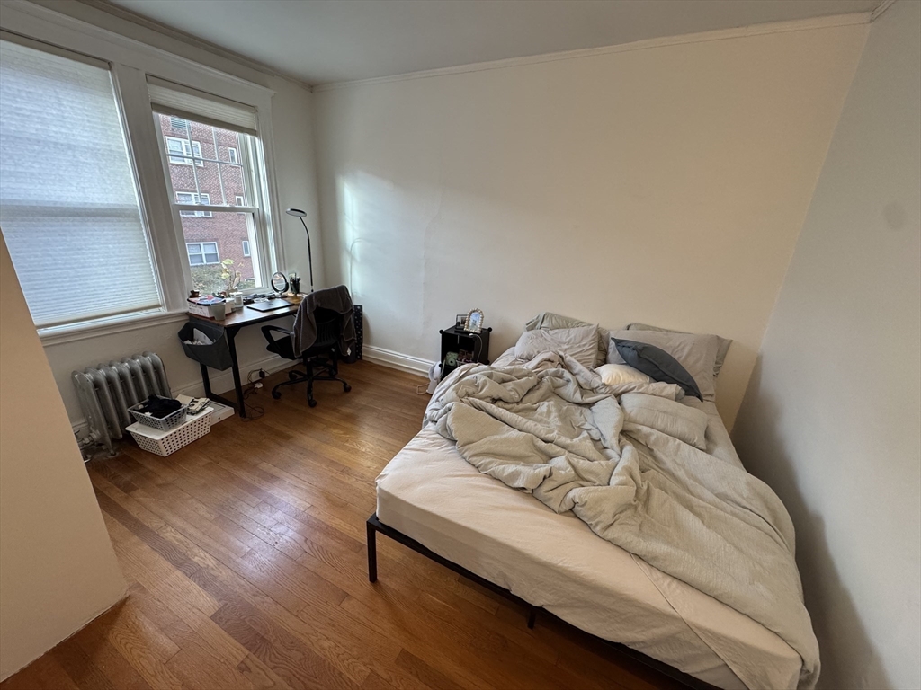 10 Alton Court, Unit 2 Brookline, MA 02446 - Photo 15 of 17 a living room with furniture and wooden floor