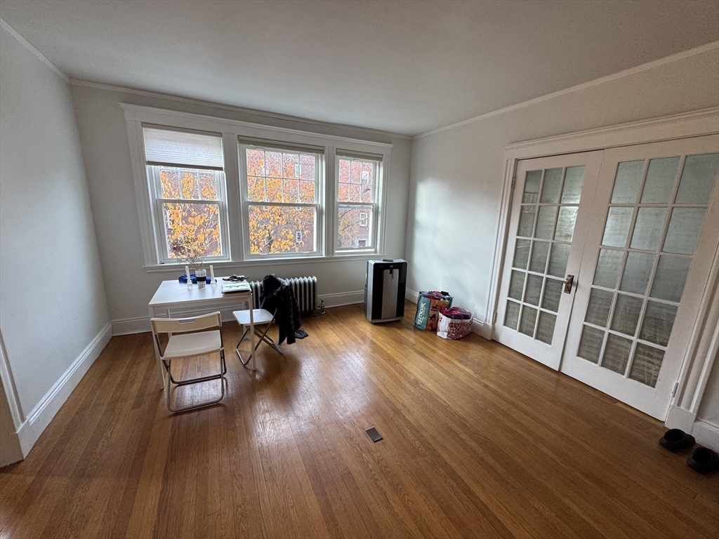 10 Alton Court, Unit 2 Brookline, MA 02446 - Photo 6 of 17 a living room with furniture and a wooden floor