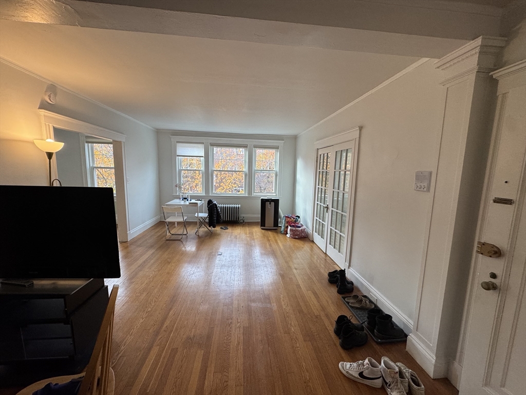 10 Alton Court, Unit 2 Brookline, MA 02446 - Photo 7 of 17 a living room with furniture and a flat screen tv