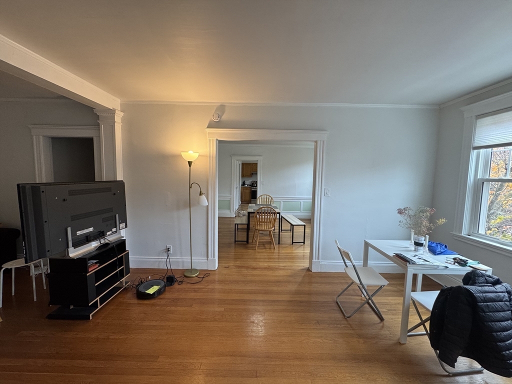 10 Alton Court, Unit 2 Brookline, MA 02446 - Photo 9 of 17 a living room with furniture and a flat screen tv