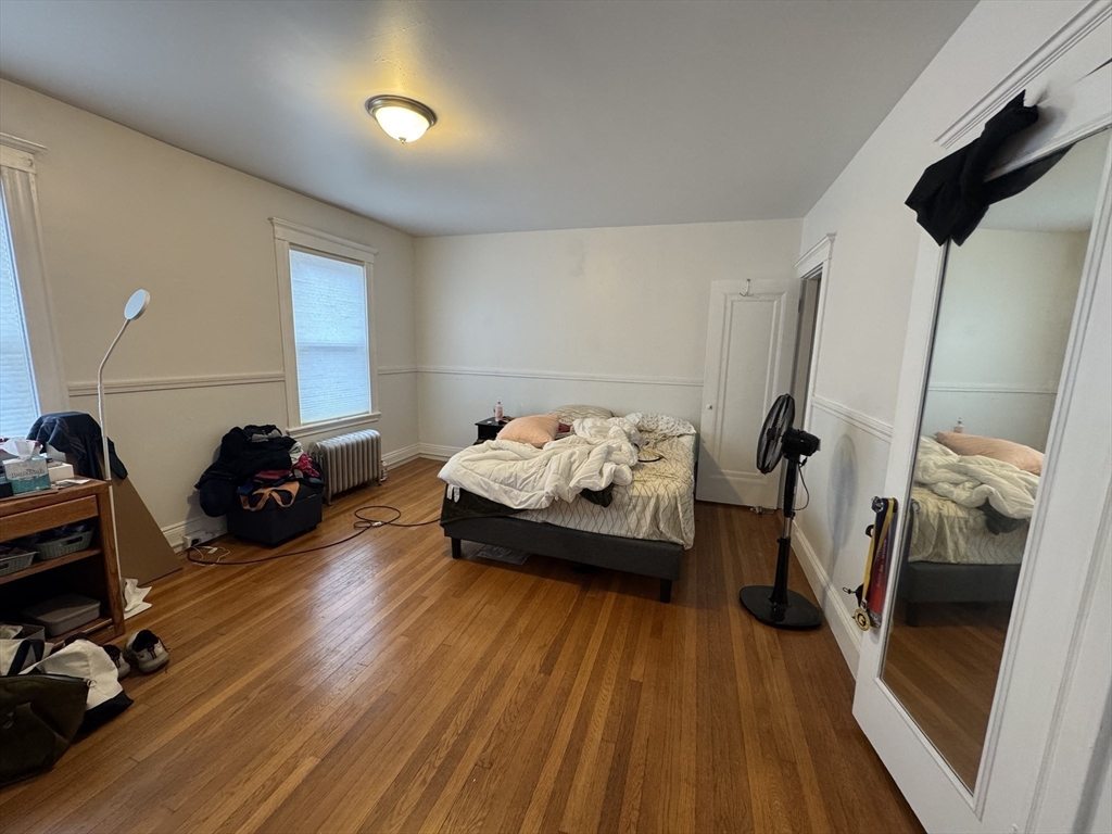 10 Alton Court, Unit 2 Brookline, MA 02446 - Photo 10 of 17 a living room with furniture and a wooden floor