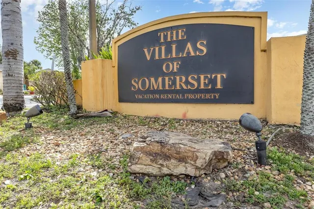 a kitchen with stainless steel appliances a refrigerator and a stove