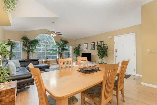 a bedroom with two beds and painting on the wall