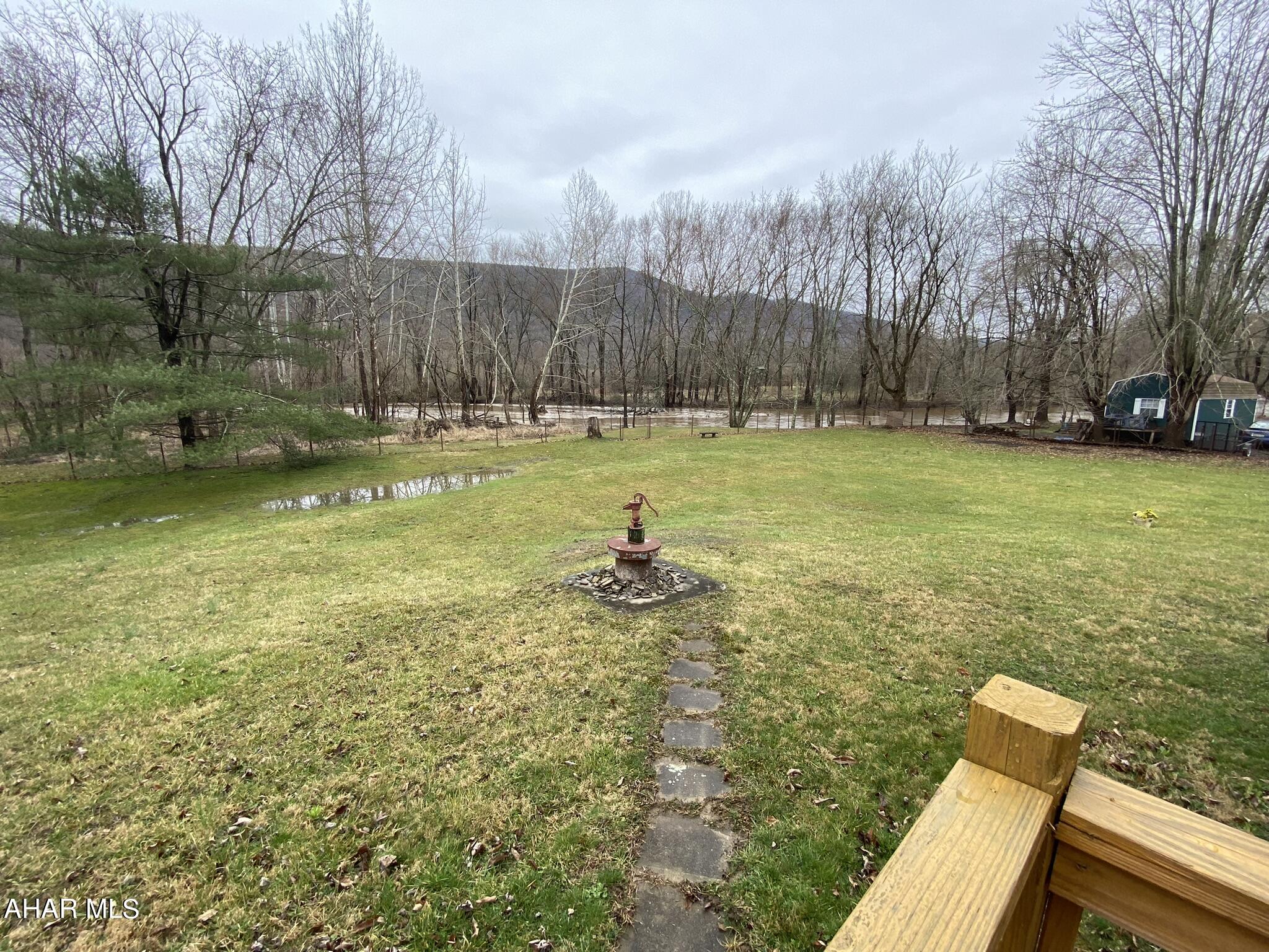 157 Stuckeysville Road Manns Choice, PA 15550 - Photo 17 of 28 a view of a swimming pool with a yard and a large tree