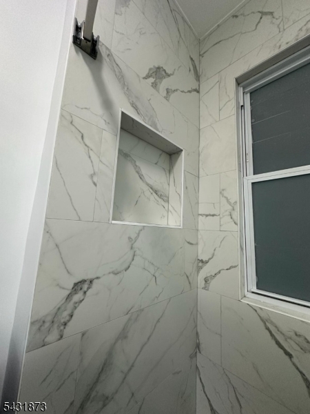 32 Hamilton Avenue, Unit 2 Fairview, NJ 07022 - Photo 7 of 30 a bathroom with a shower
