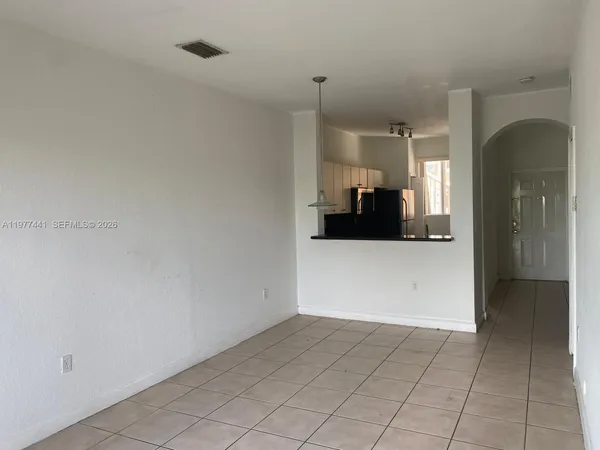 a view of a kitchen cabinets and a window
