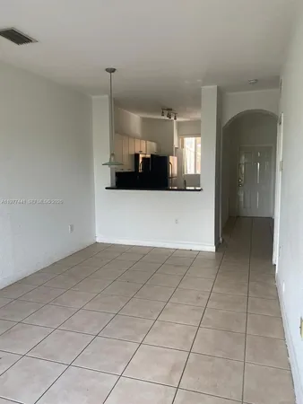 a view of a bathroom with a sink and a mirror