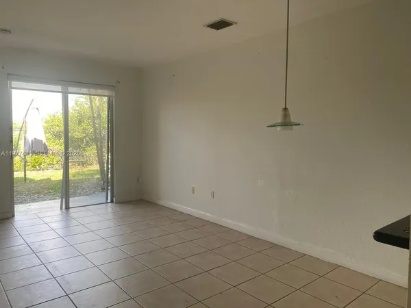 a view of an empty room and window