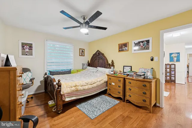 a bedroom that has a bed and a chandelier