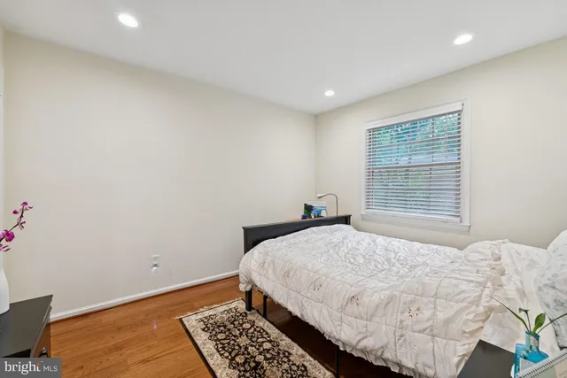 a bedroom that has a bed and a chandelier