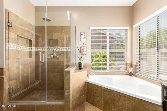 a bathroom with a bathtub and a shower