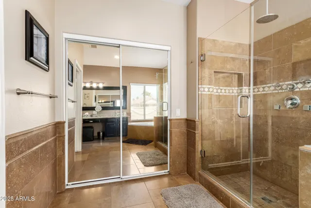 a bathroom with a tub and shower
