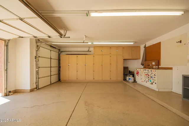a view of a porch with furniture and a yard
