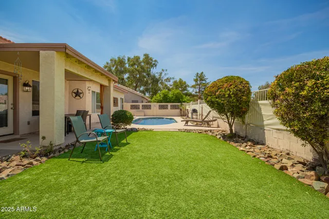 a view of a swimming pool with a lounge chairs