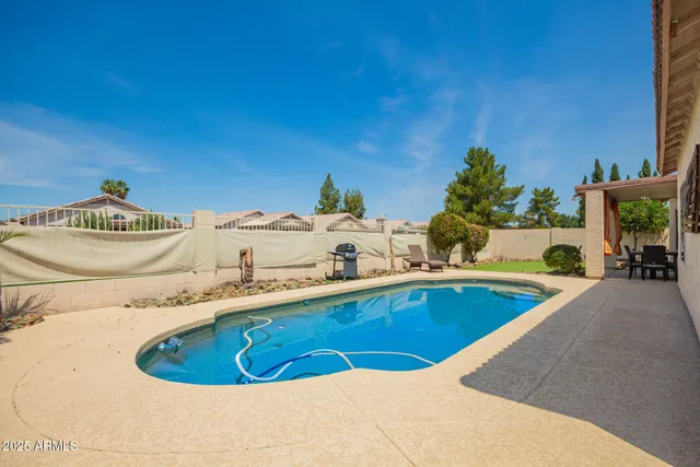 a swimming pool with a outdoor seating