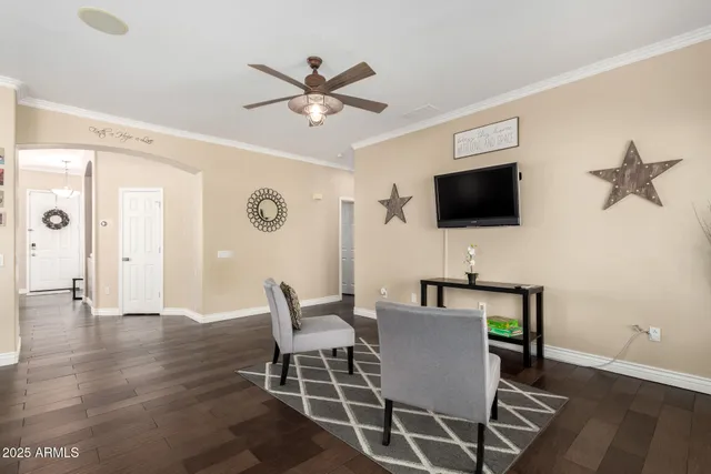 a view of a livingroom with furniture and a flat screen tv