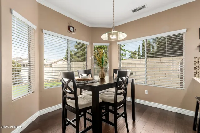a view of a dining room with furniture window and outside view