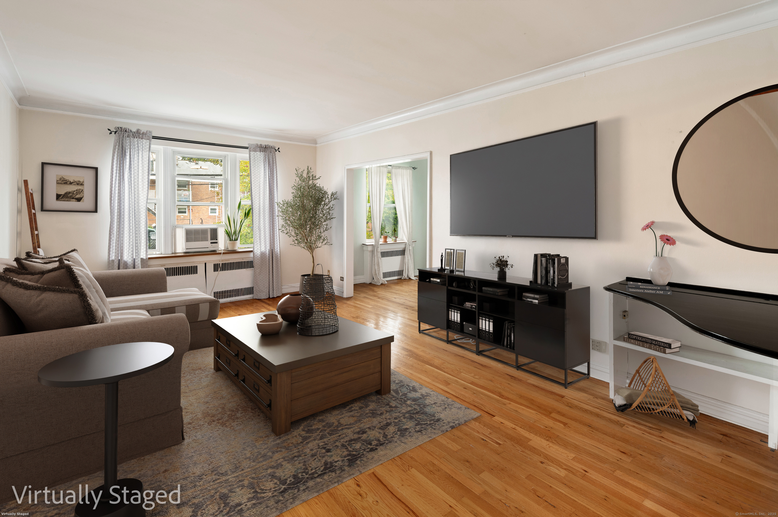 70 Strawberry Hill Avenue, Unit 22D Stamford, CT 06902 - Photo 11 of 39 a living room with furniture and a flat screen tv with wooden floor