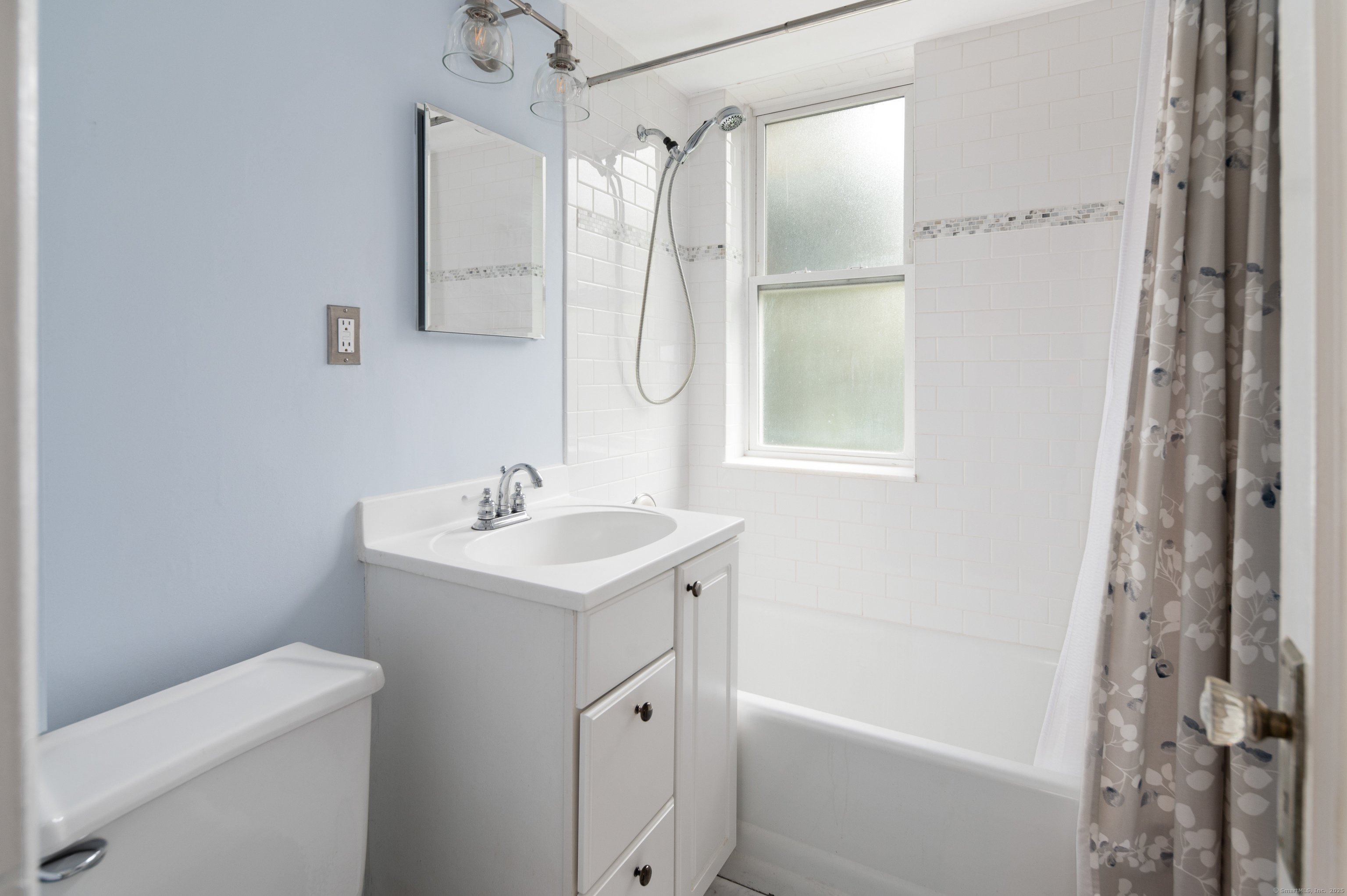70 Strawberry Hill Avenue, Unit 22D Stamford, CT 06902 - Photo 21 of 39 a bathroom with a sink a toilet and shower