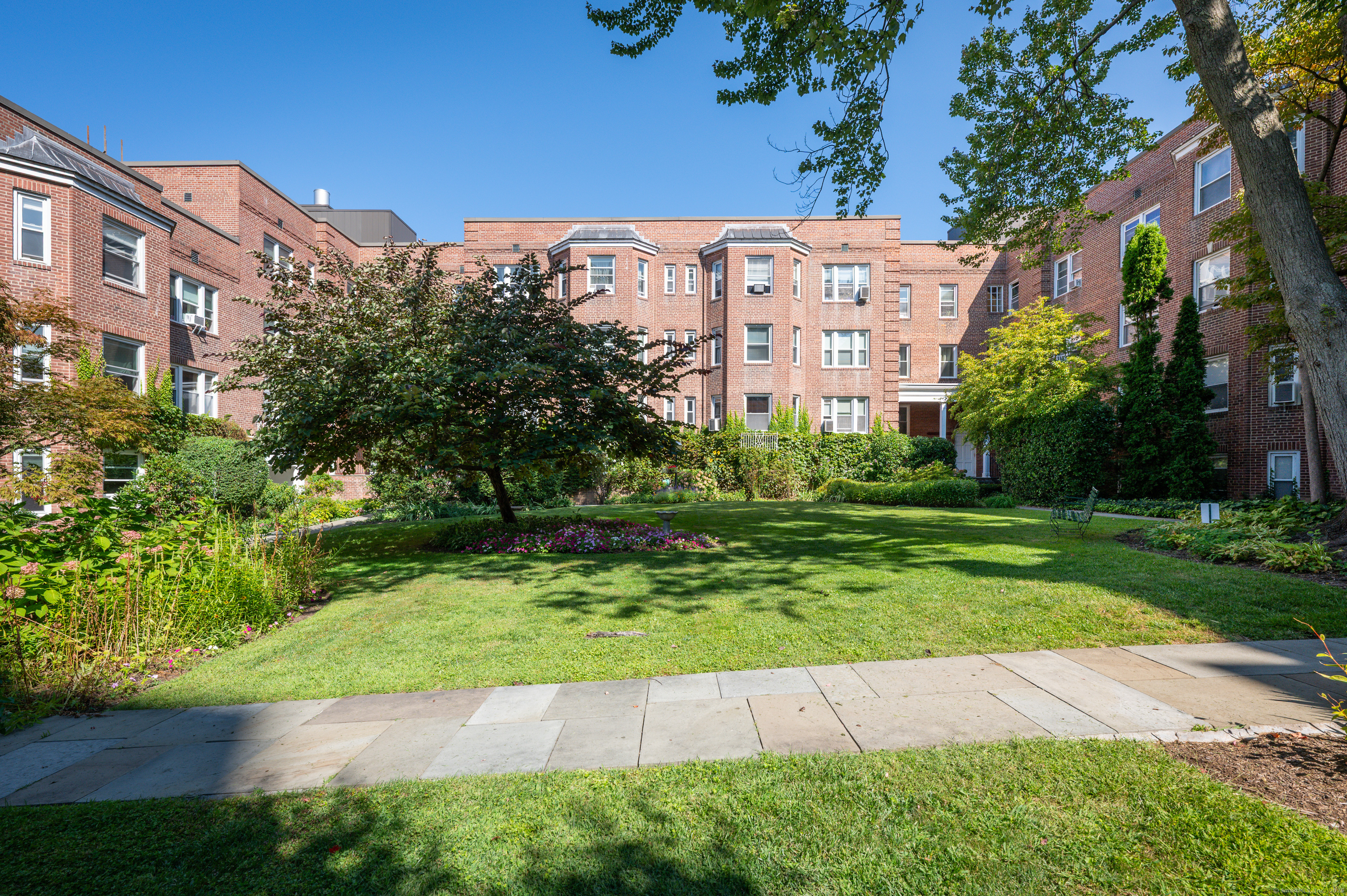 70 Strawberry Hill Avenue, Unit 22D Stamford, CT 06902 - Photo 27 of 39 a view of a city with tall buildings and a big yard