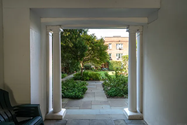 a view of a back yard from a tub