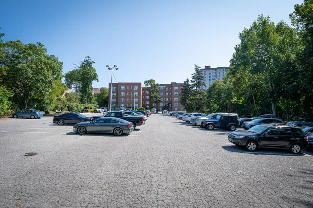 a view of street with parked cars