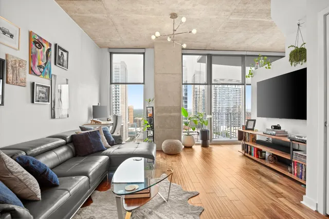 a living room with furniture and a flat screen tv
