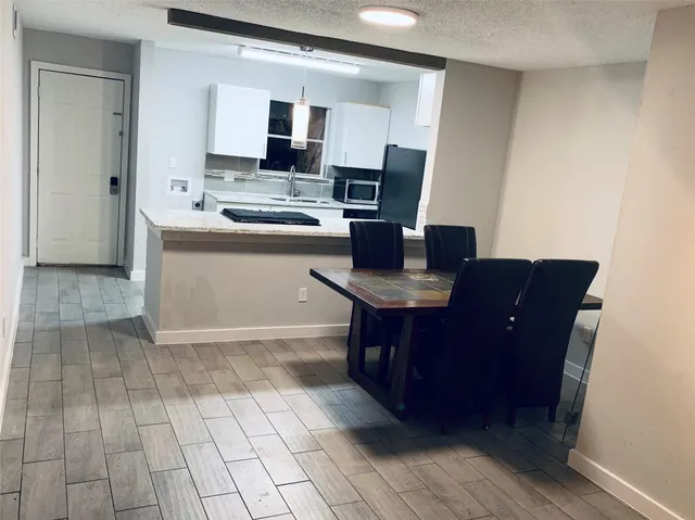 a kitchen with a sink cabinets and appliances