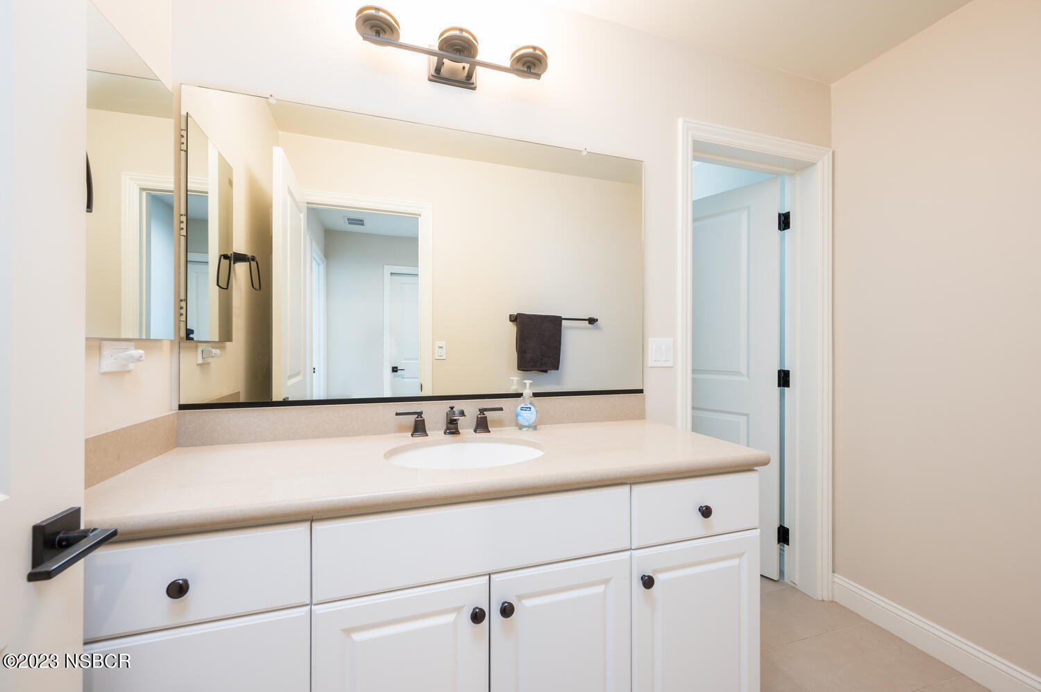 625 Agapanthus Way Santa Maria, CA 93455 - Photo 21 of 37 a bathroom with a sink and a mirror