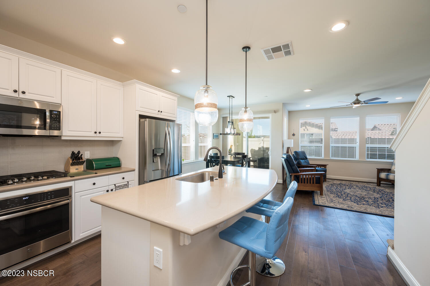 625 Agapanthus Way Santa Maria, CA 93455 - Photo 6 of 37 a large kitchen with sink a refrigerator and chairs