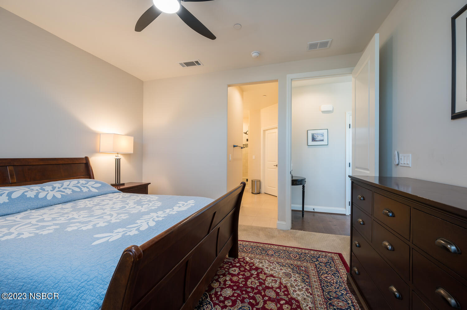 625 Agapanthus Way Santa Maria, CA 93455 - Photo 10 of 37 a bedroom with a bed and a lamp on dresser