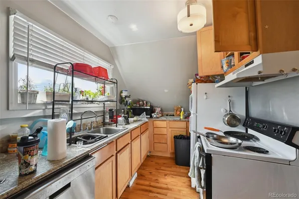 a room with furniture and a wooden floor
