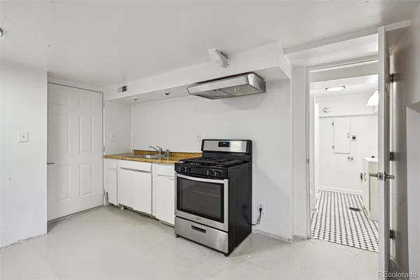 a view of a kitchen cabinets and a stove top oven