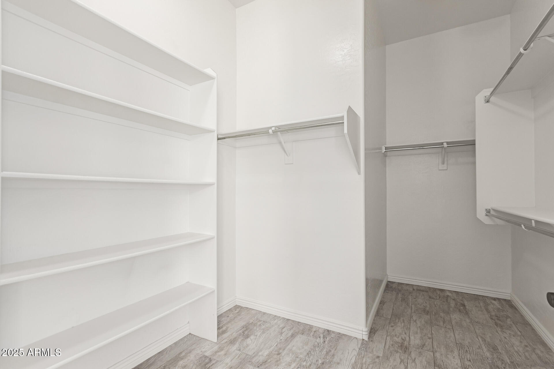 3054 South Colonial Street Gilbert, AZ 85295 - Photo 14 of 29 a view of an empty walk in closet